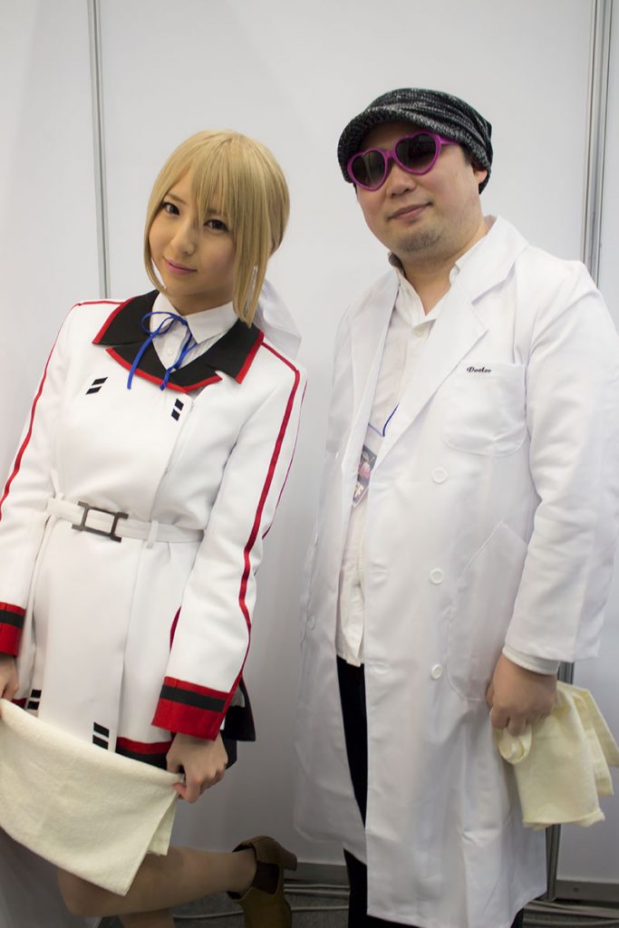 Two masseuses from the Infinite Stratos 2 booth.